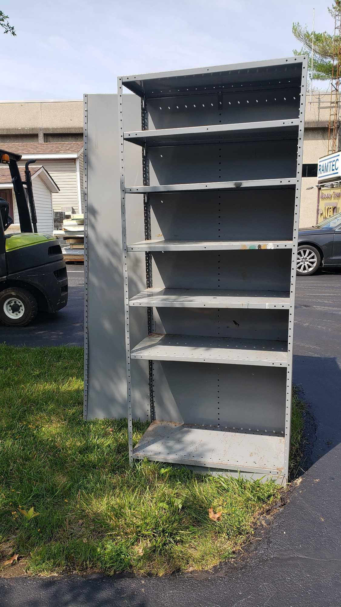 Two sets of metal adjustable shelving units. Approximately 7 ft tall by 3 ft long by 1 ft 6 in deep