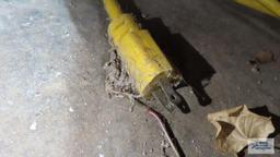 Heavy duty yellow extension cord with three outlet end