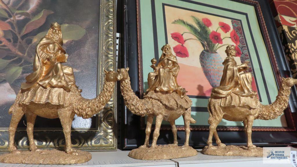 Three composite wise man on camel figurines. One is broken.