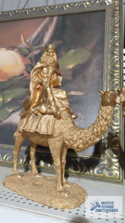 Three composite wise man on camel figurines. One is broken.