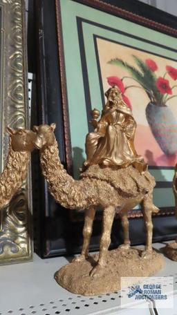 Three composite wise man on camel figurines. One is broken.