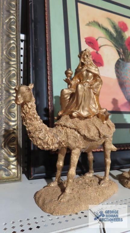 Three composite wise man on camel figurines. One is broken.