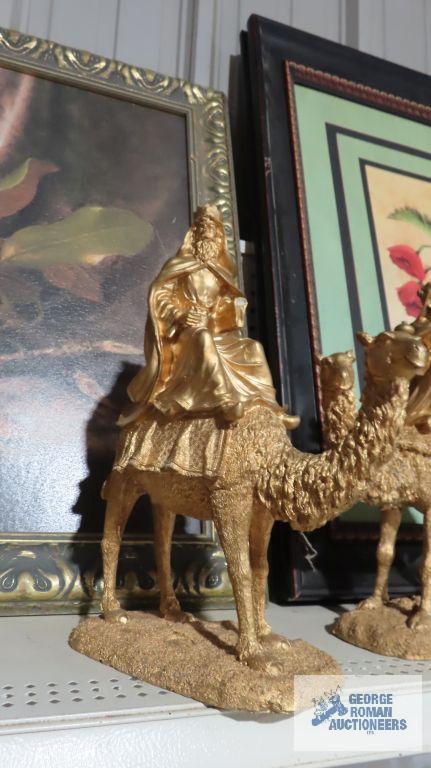 Three composite wise man on camel figurines. One is broken.