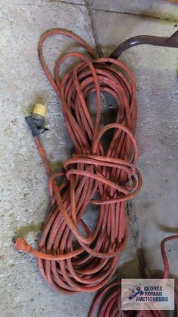 Two heavy duty extension cords. One needs repaired.
