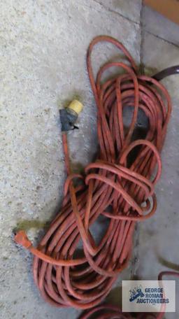 Two heavy duty extension cords. One needs repaired.