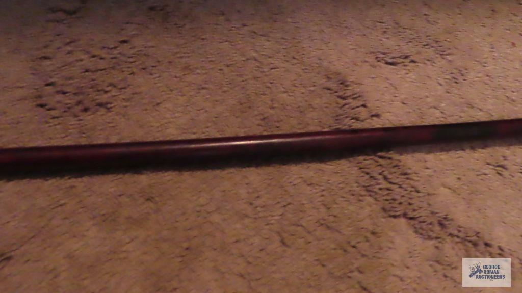 Wood and metal spear with hanging elements