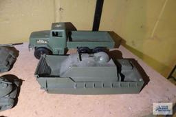 lot of plastic tanks, trucks, and etc