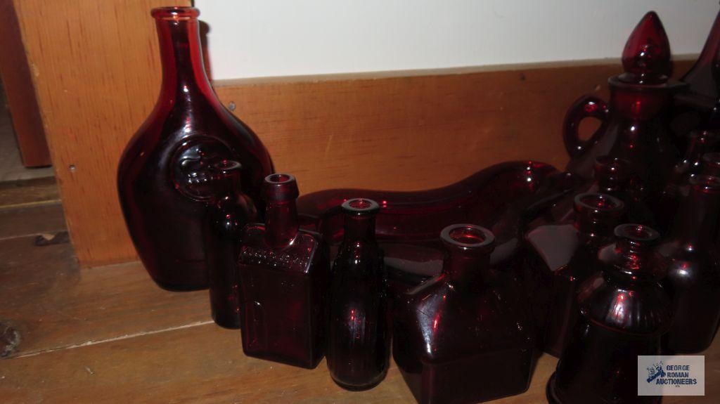 Ruby ashtray and assorted miniature bottles