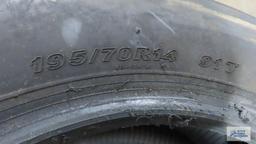 Lot of tires on rims and Kenetica radial 14-inch tire