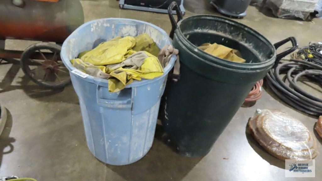 Lot of rain gear, safety shield masks and fire extinguishers