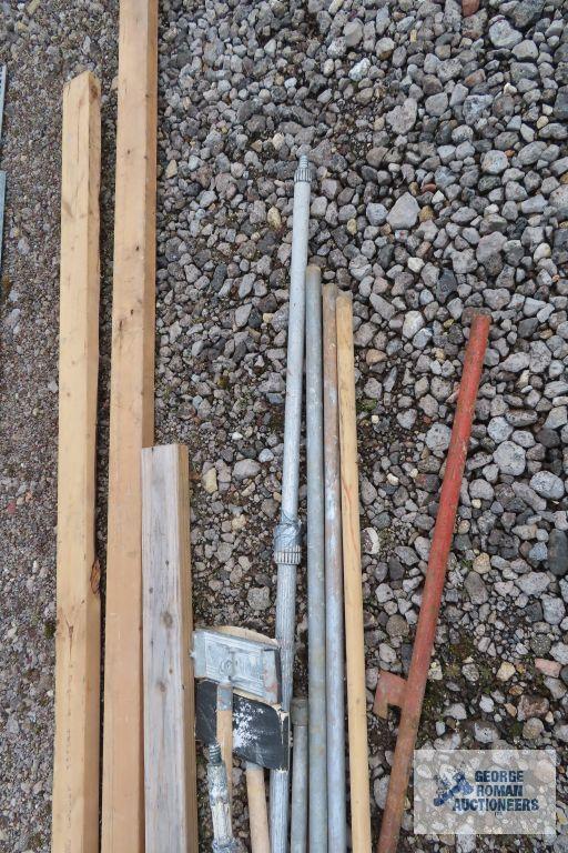 Lot of painters poles, drywall sanders, and 2x4s