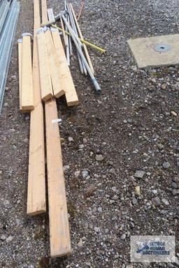 Lot of painters poles, drywall sanders, and 2x4s