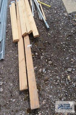 Lot of painters poles, drywall sanders, and 2x4s