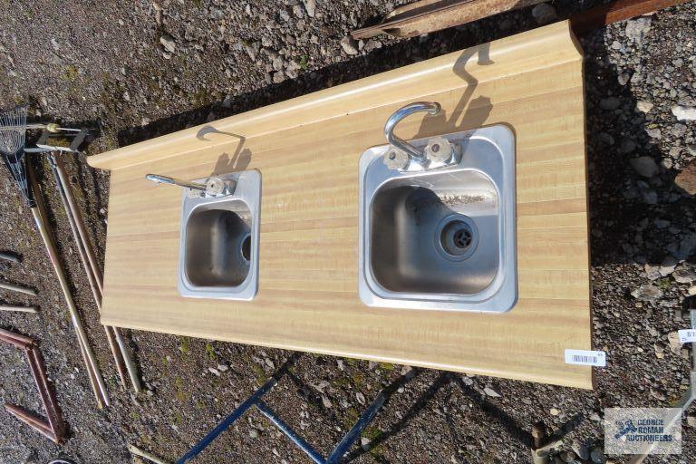 Formica top...countertop with two stainless steel hand sinks