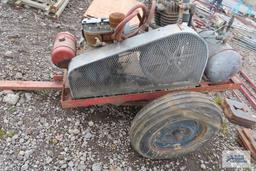 Heavy duty gas air compressor mounted on heavy duty trailer. Kohler engine