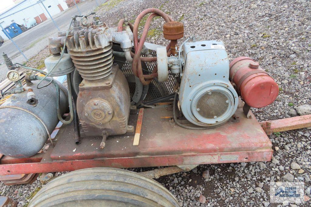 Heavy duty gas air compressor mounted on heavy duty trailer. Kohler engine