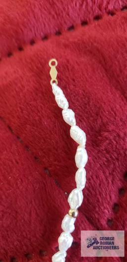 Pearl like beads and gold color beads bracelet, marked 14K, approximate total weight is 2.65 G
