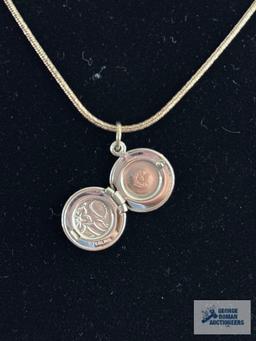 Silver colored round locket, marked Beau Sterling, on silver colored chain, marked...925 Milor Italy