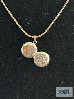 Silver colored round locket, marked Beau Sterling, on silver colored chain, marked...925 Milor Italy