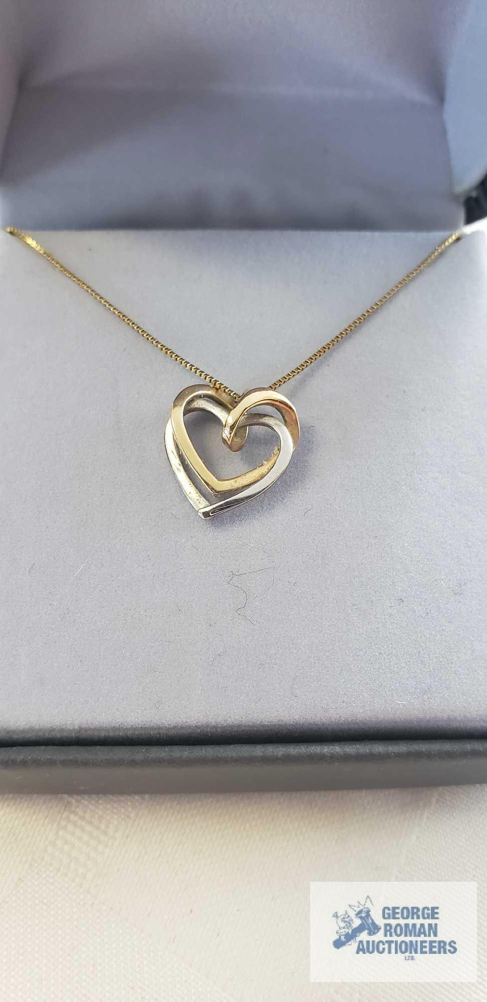 Gold and silver colored heart pendant, marked 14K on gold colored chain, marked 14K Italy,
