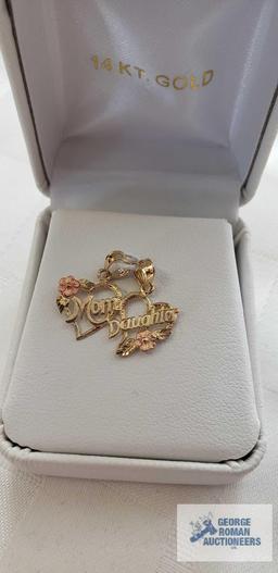 Gold and pink colored mother and daughter pendants, marked 14K, approximate total weight 1.13 G