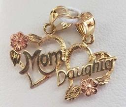 Gold and pink colored mother and daughter pendants, marked 14K, approximate total weight 1.13 G