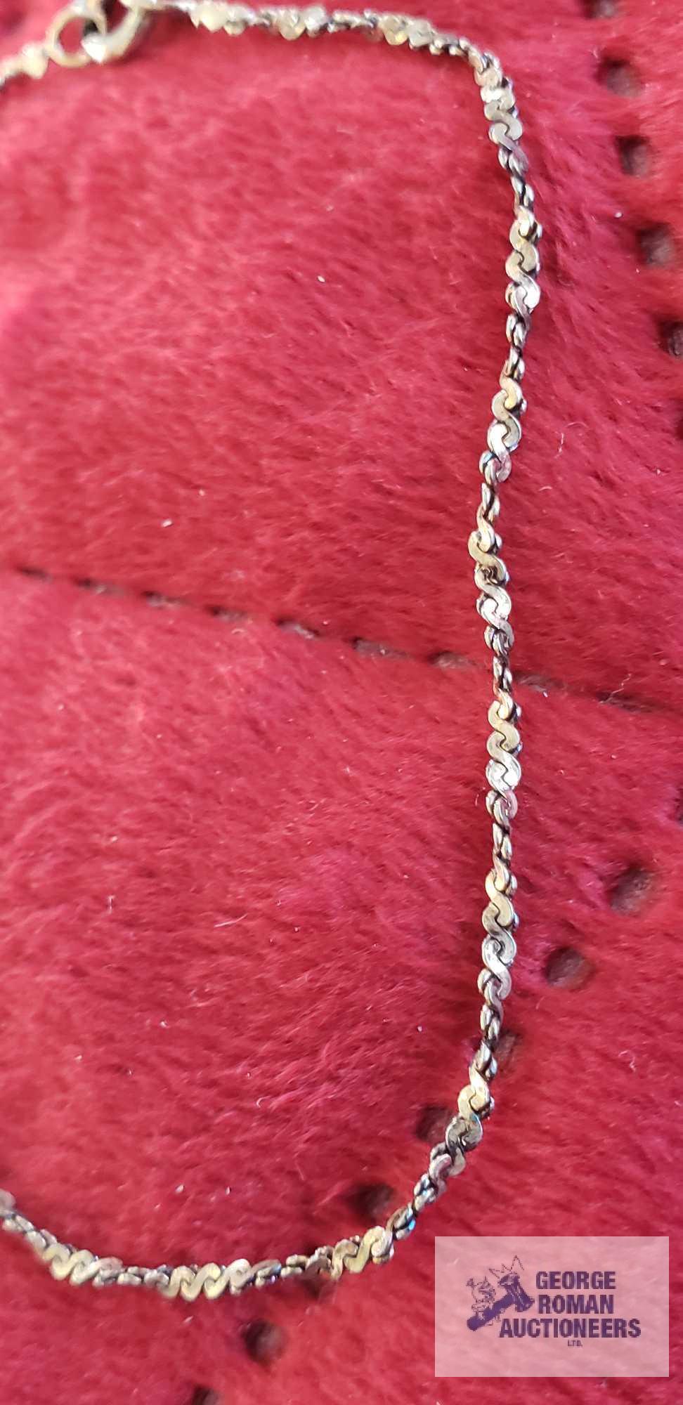 Silver colored twist bracelet, marked 925, approximate total weight is 1.47 G