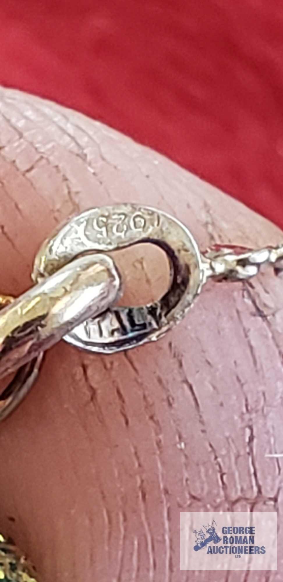 Silver colored twist bracelet, marked 925, approximate total weight is 1.47 G