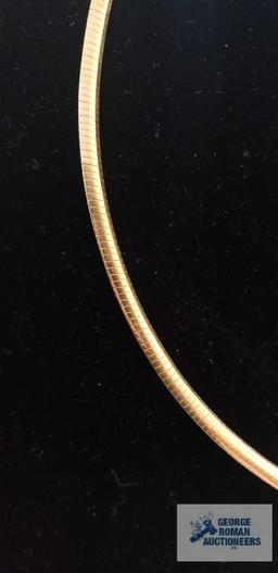 Serpentine two-sided, one gold colored, one silver colored, necklace, marked 14KT Italy, total