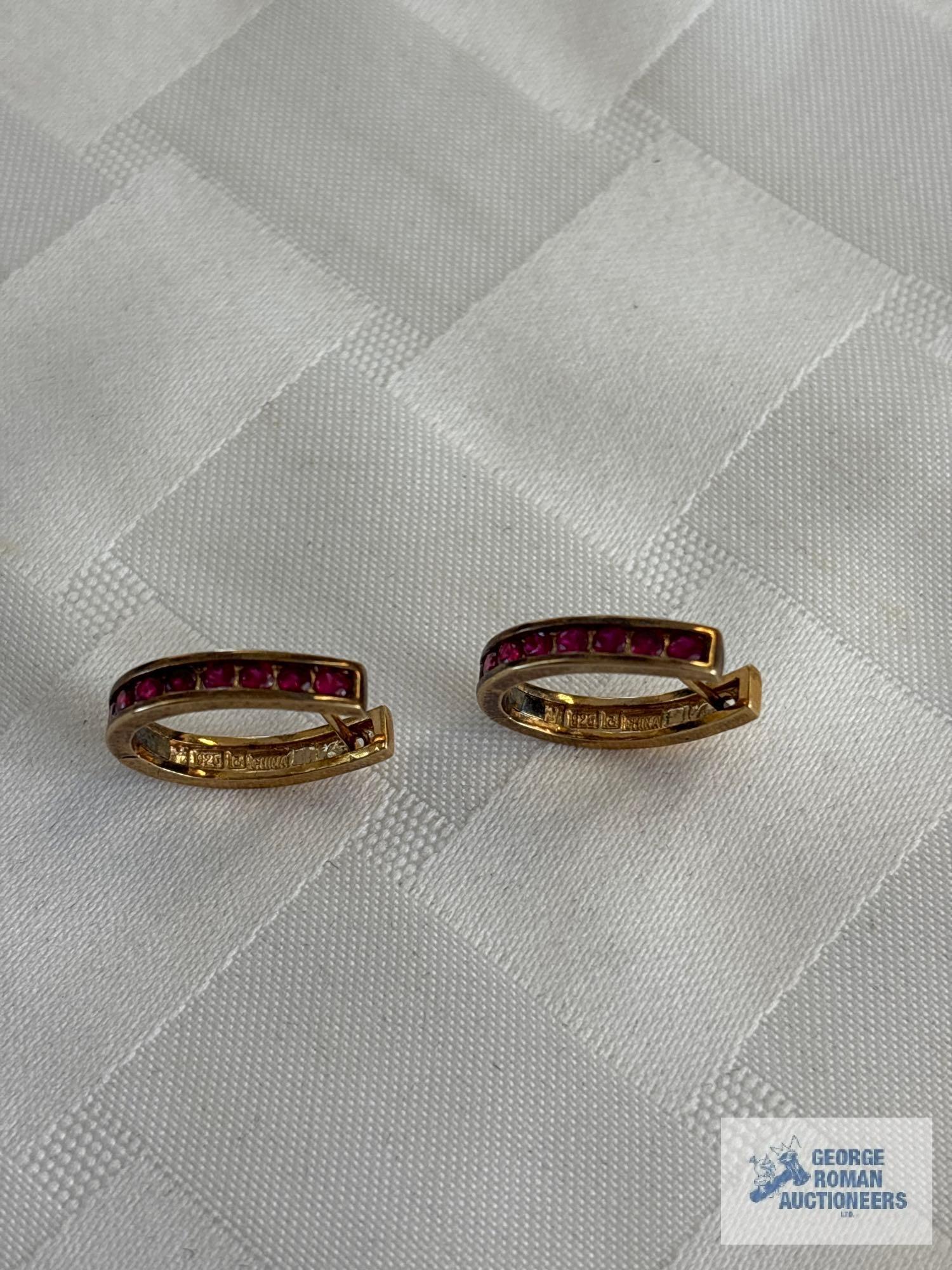 Gold colored earrings with reddish pink gemstones, marked 925, approximate total weight 4.95 G