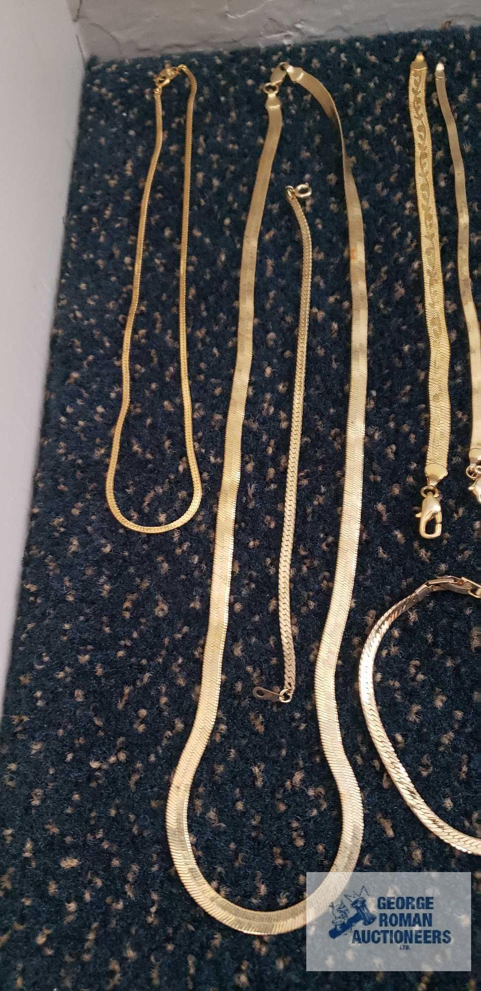 Gold colored costume jewelry necklaces and bracelets