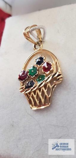 Gold colored basket of colorful flowers...pendant, marked 14K, approximate total weight is 1.31 G