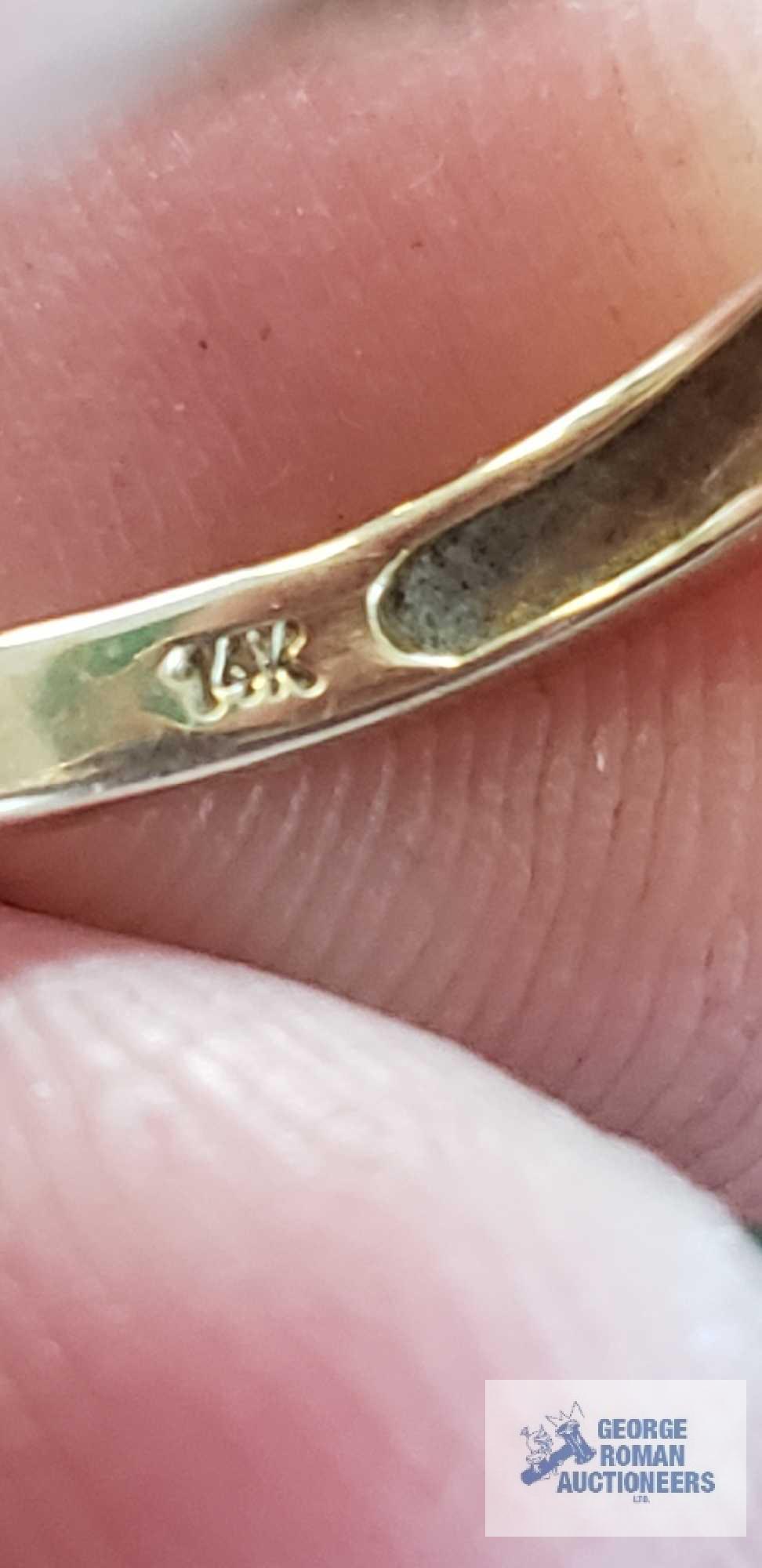 Gold...colored ring with red floral gemstones and clear gemstones on band, marked 14K, missing one r