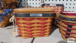 Four Longaberger 2000-2004 red and blue stripe star baskets, including 2001 inaugural basket and