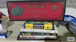 Golf books and toilet golf game