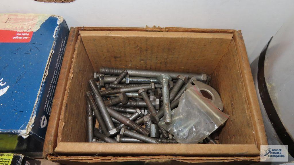 Box of hardware including hinges, nails, washers, bolts, aluminum coil, fire extinguisher