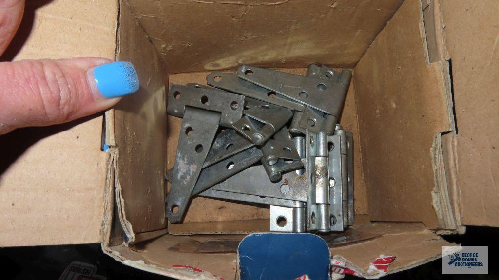 Box of hardware including hinges, nails, washers, bolts, aluminum coil, fire extinguisher