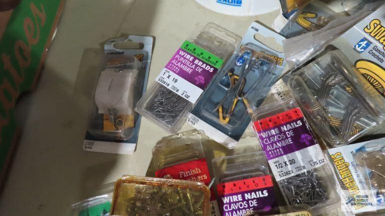 Assorted hardware including nails, screws, hangers