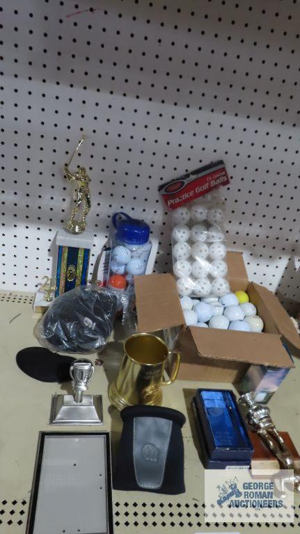 Golf balls, trophies, and other golfing items