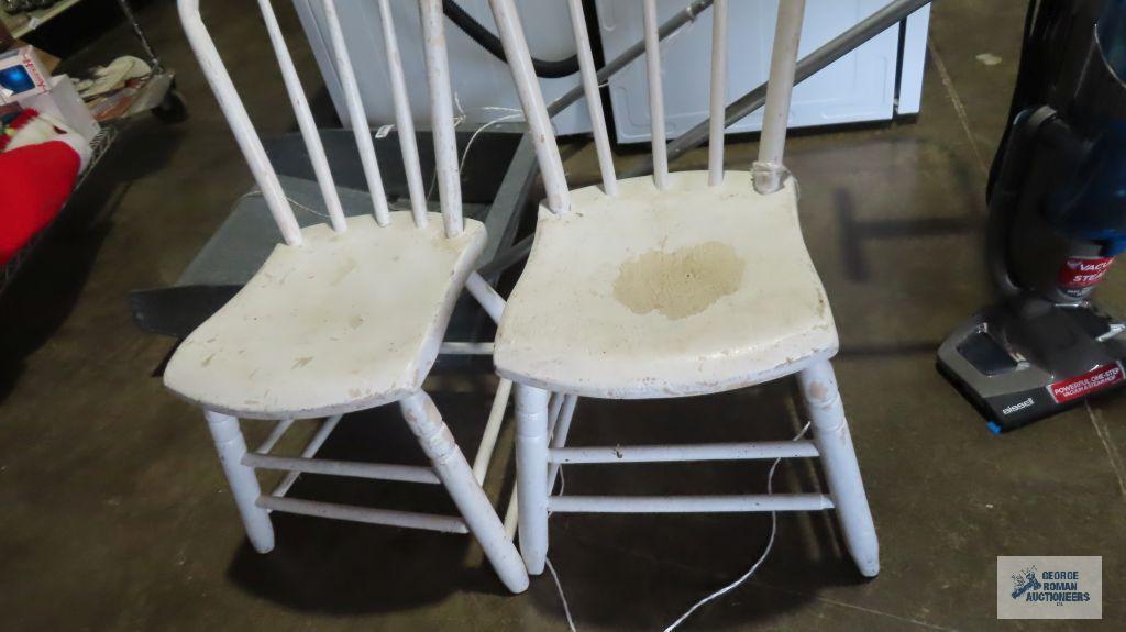 Two painted white wooden chairs