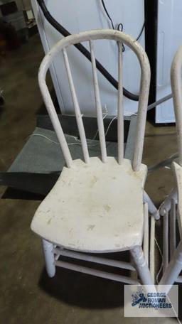 Two painted white wooden chairs