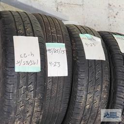 Lot of assorted tires on wooden rack