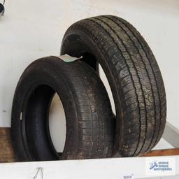 Lot of assorted tires on wooden rack