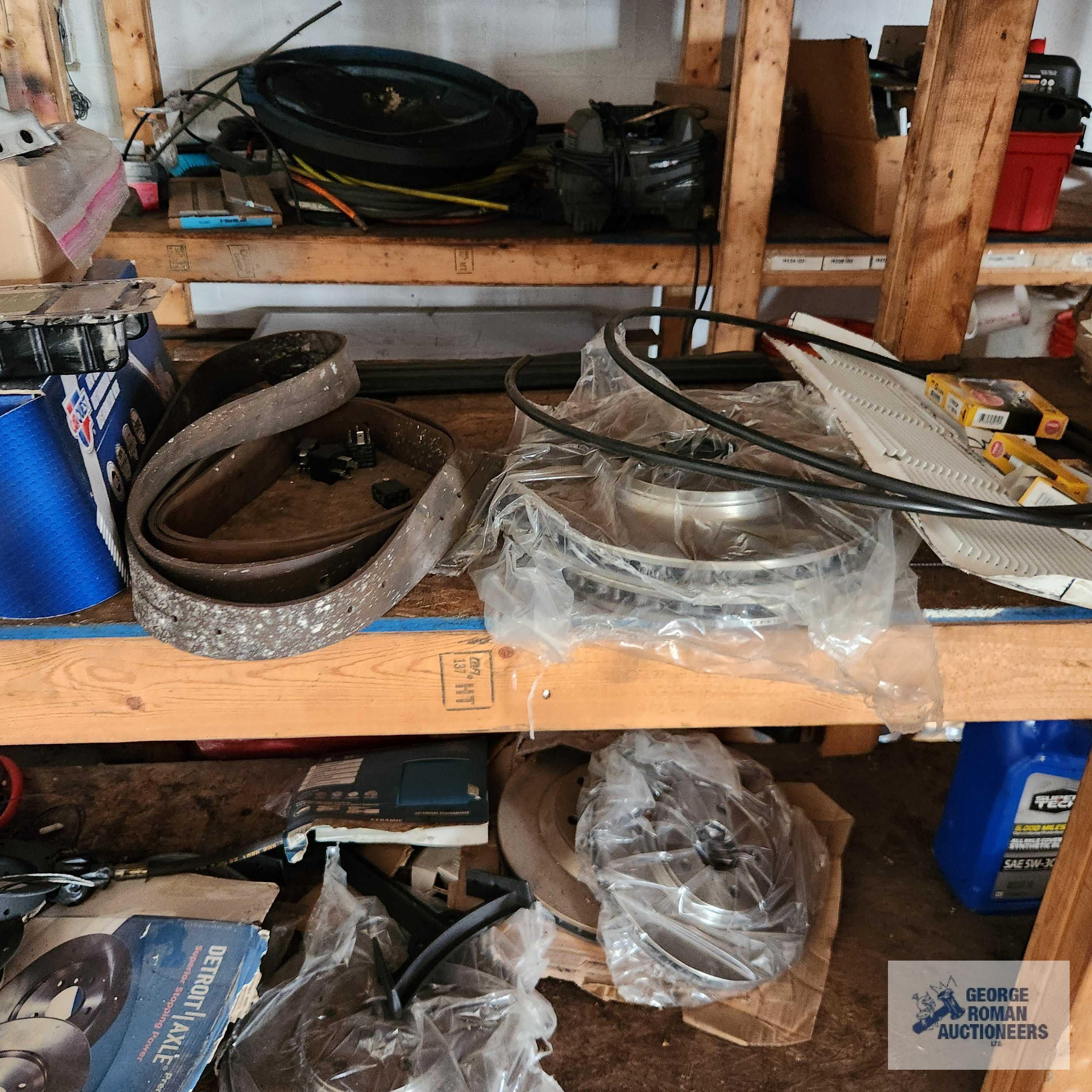 Lot of automotive parts, paints, hardware and etc on front shelving