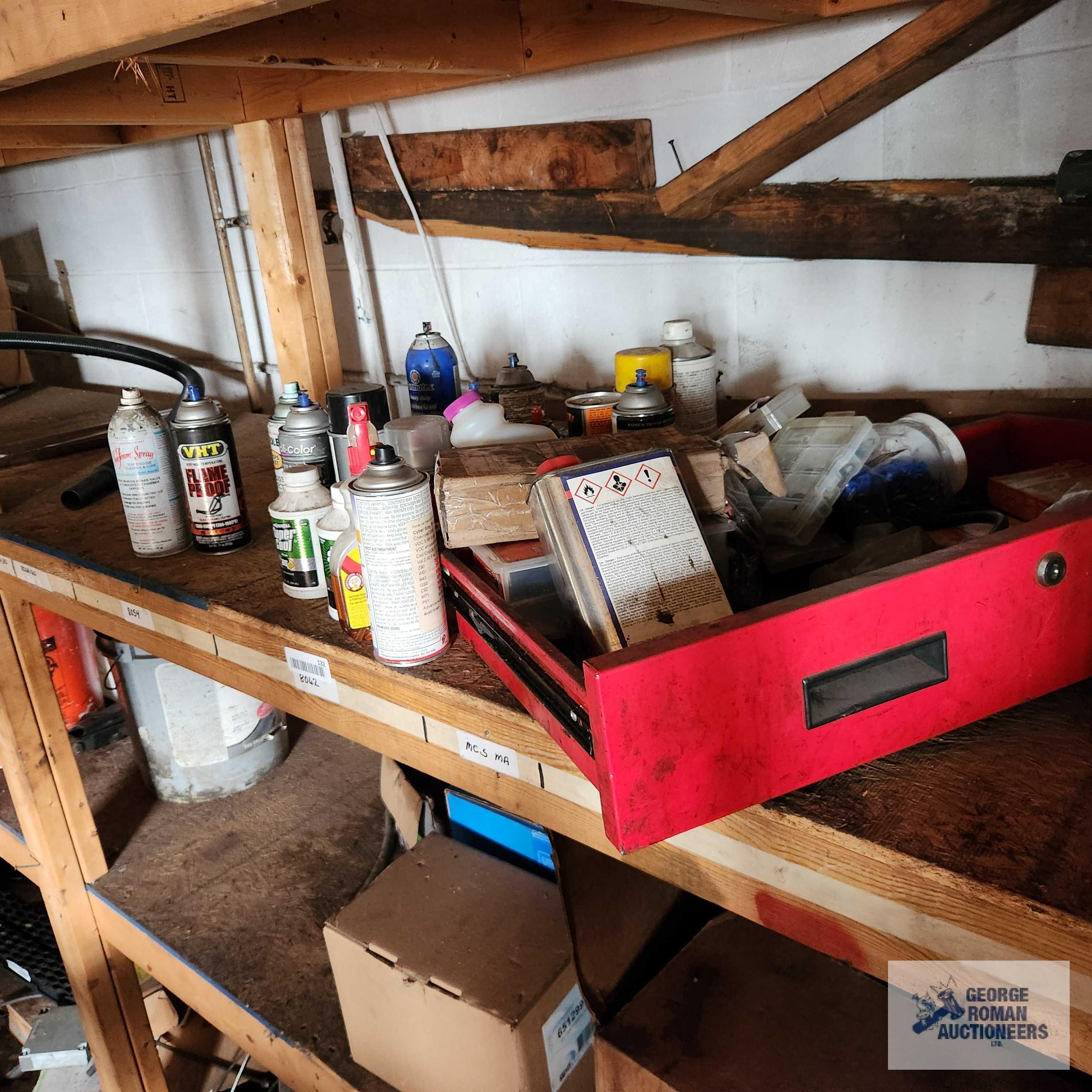 Lot of automotive parts, oils, paints and etc on back shelving