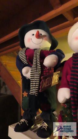 Two snowman figurines. approximately 18 in. tall