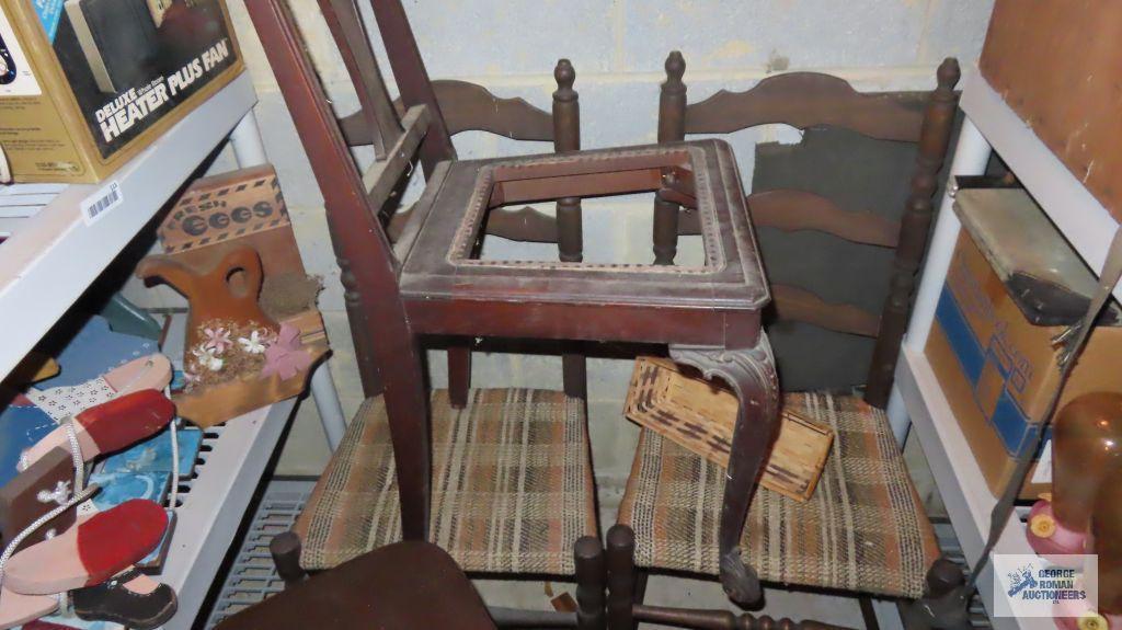 Assorted chairs, ironing board, and wooden stool