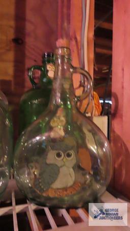 Four decorative glass jugs
