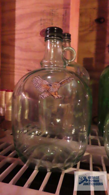 Four decorative glass jugs