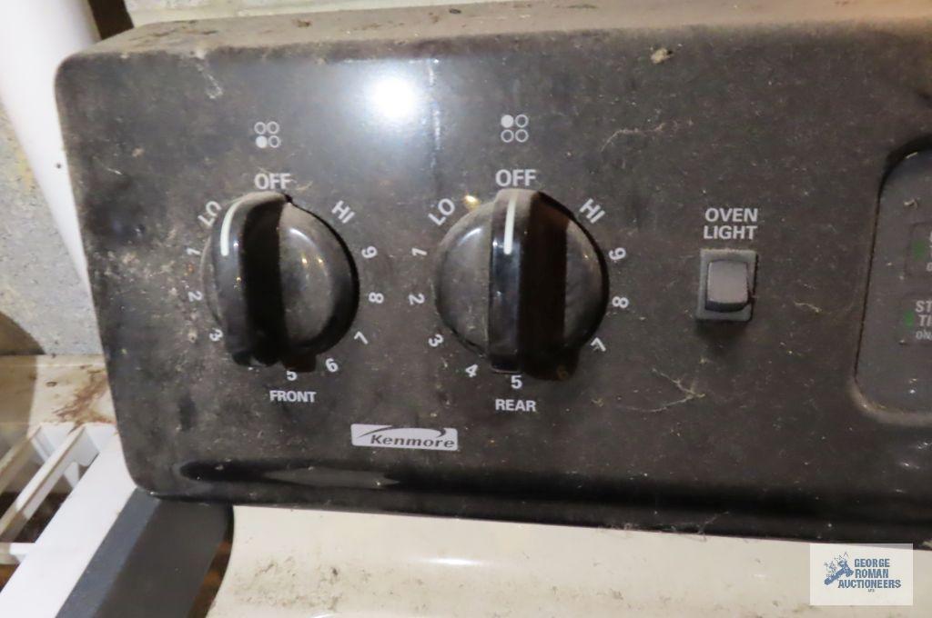 Kenmore electric range in basement